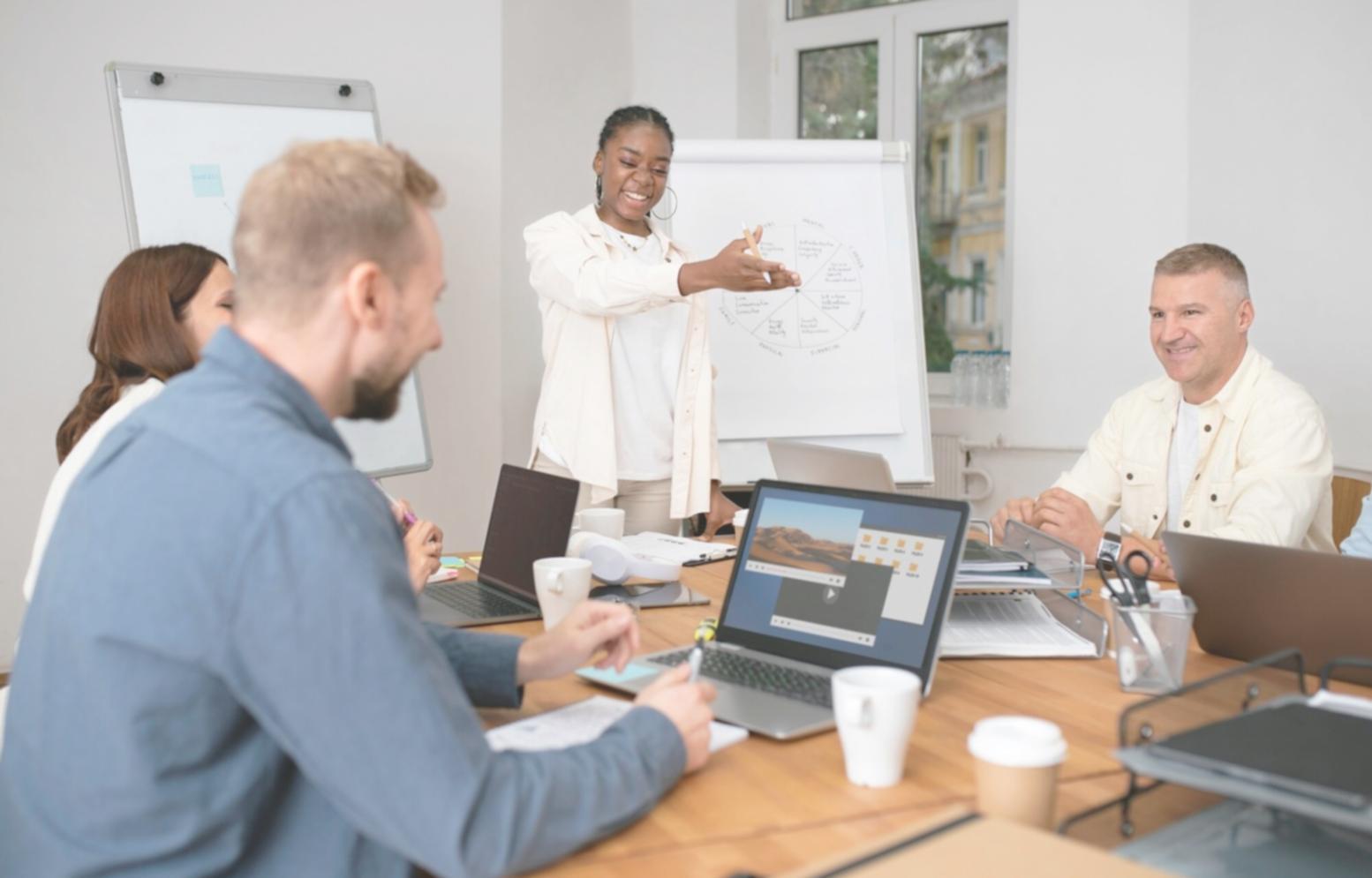 Financial professionals collaborating on budget approval workflows in a modern office environment